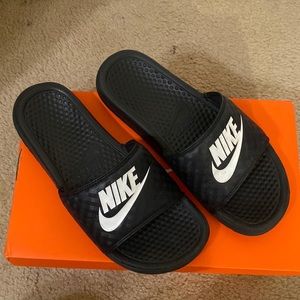 Black and white Nike slides